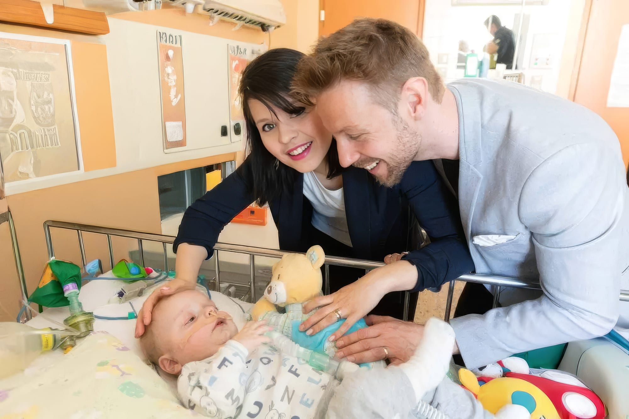 Gregor in Nina ob otroku z redko boleznijo v bolnišnici